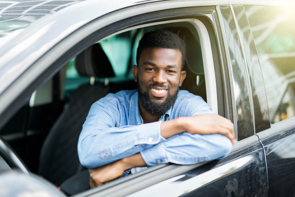 man using car for title loan