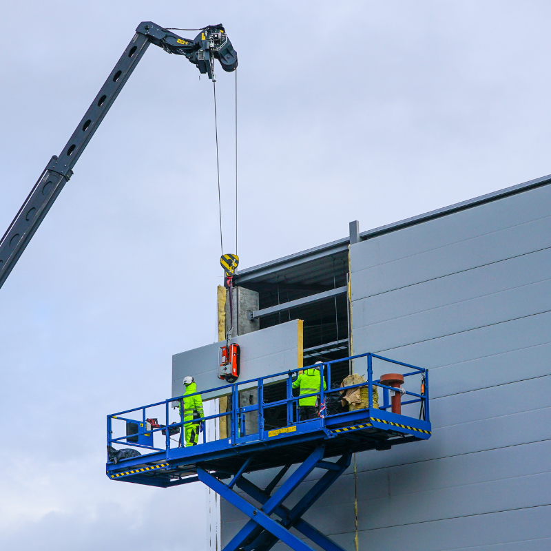 Construction Workers on a Scissor Lift