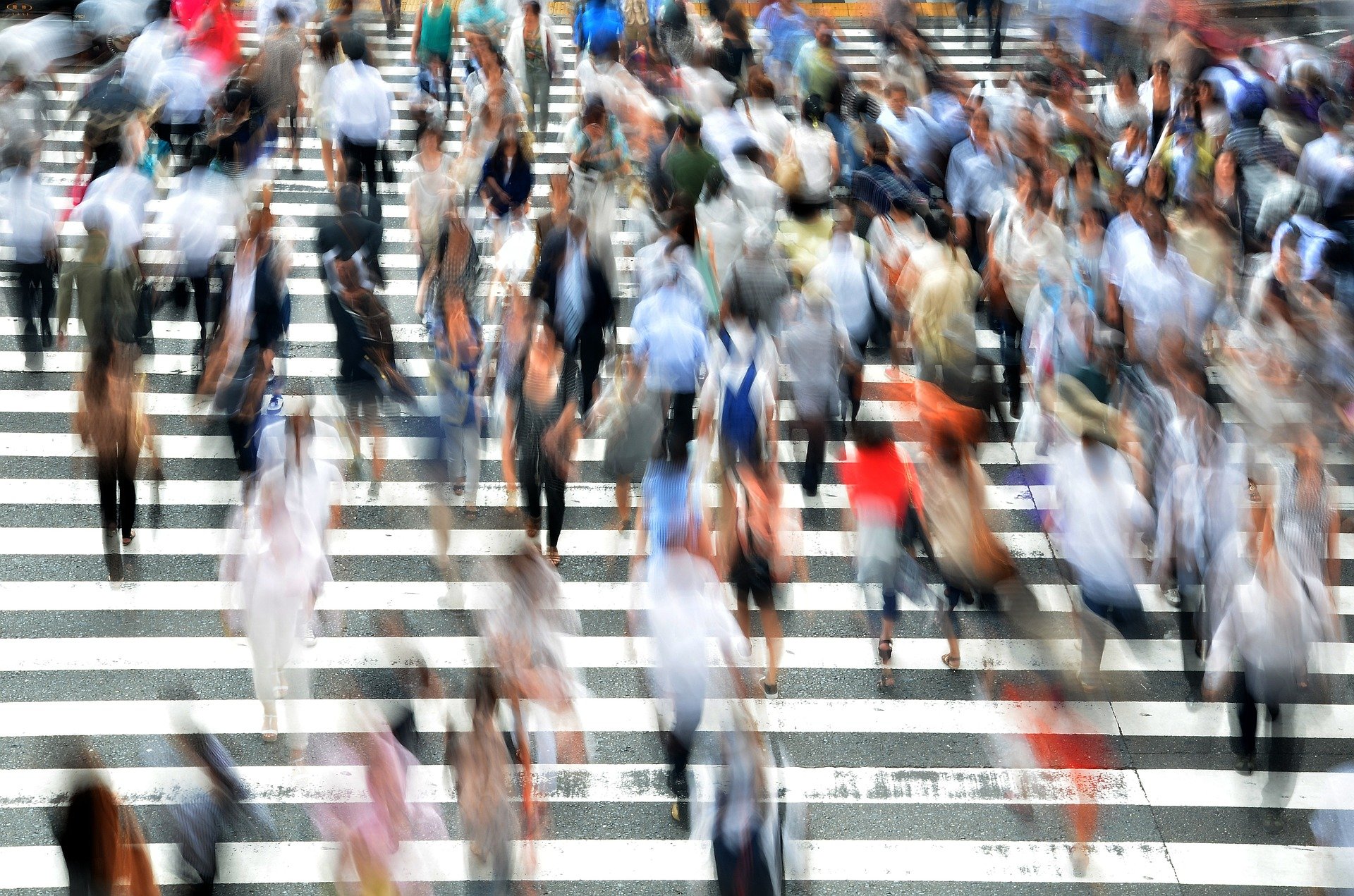 Crosswalk with blurred people crossing