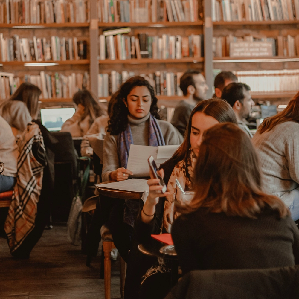 Woman studying in library.webp