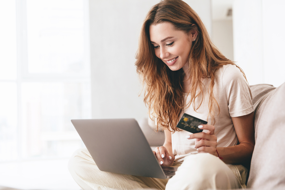 woman credit card laptop