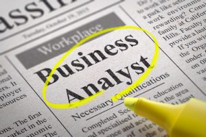 newspaper with the words business analyst circled in yellow