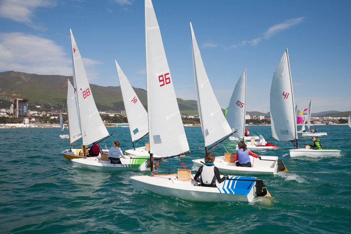 Several boats sailing on the ocean