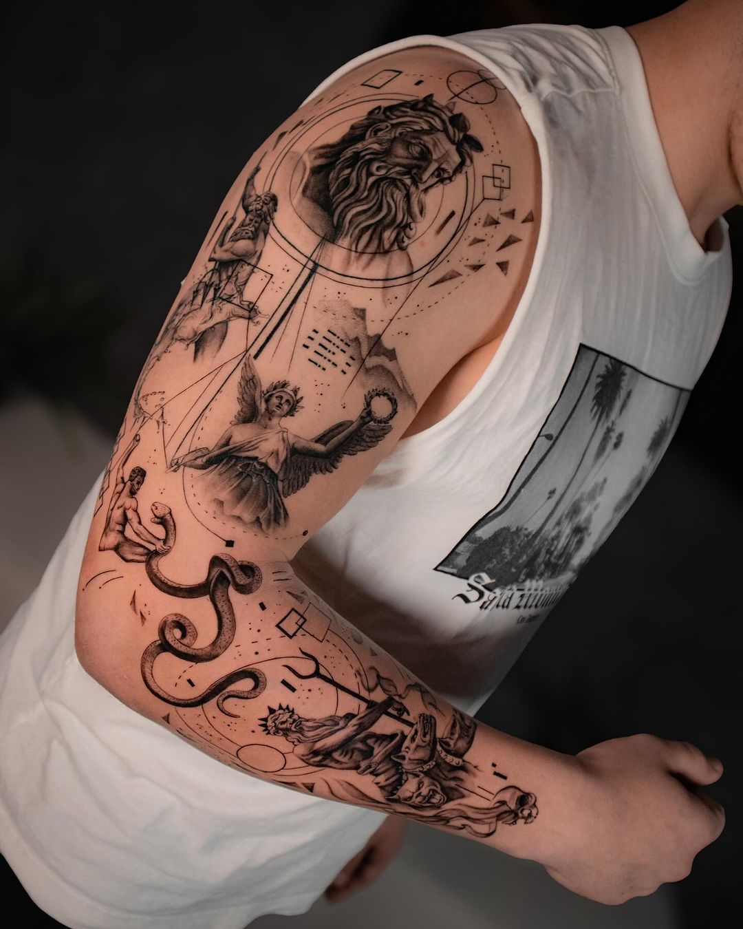 black and grey sleeve tattoo by odor benjamin
