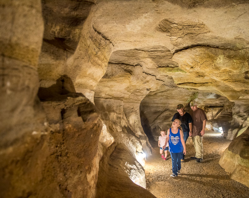 A family walking in Rickwood Caverns