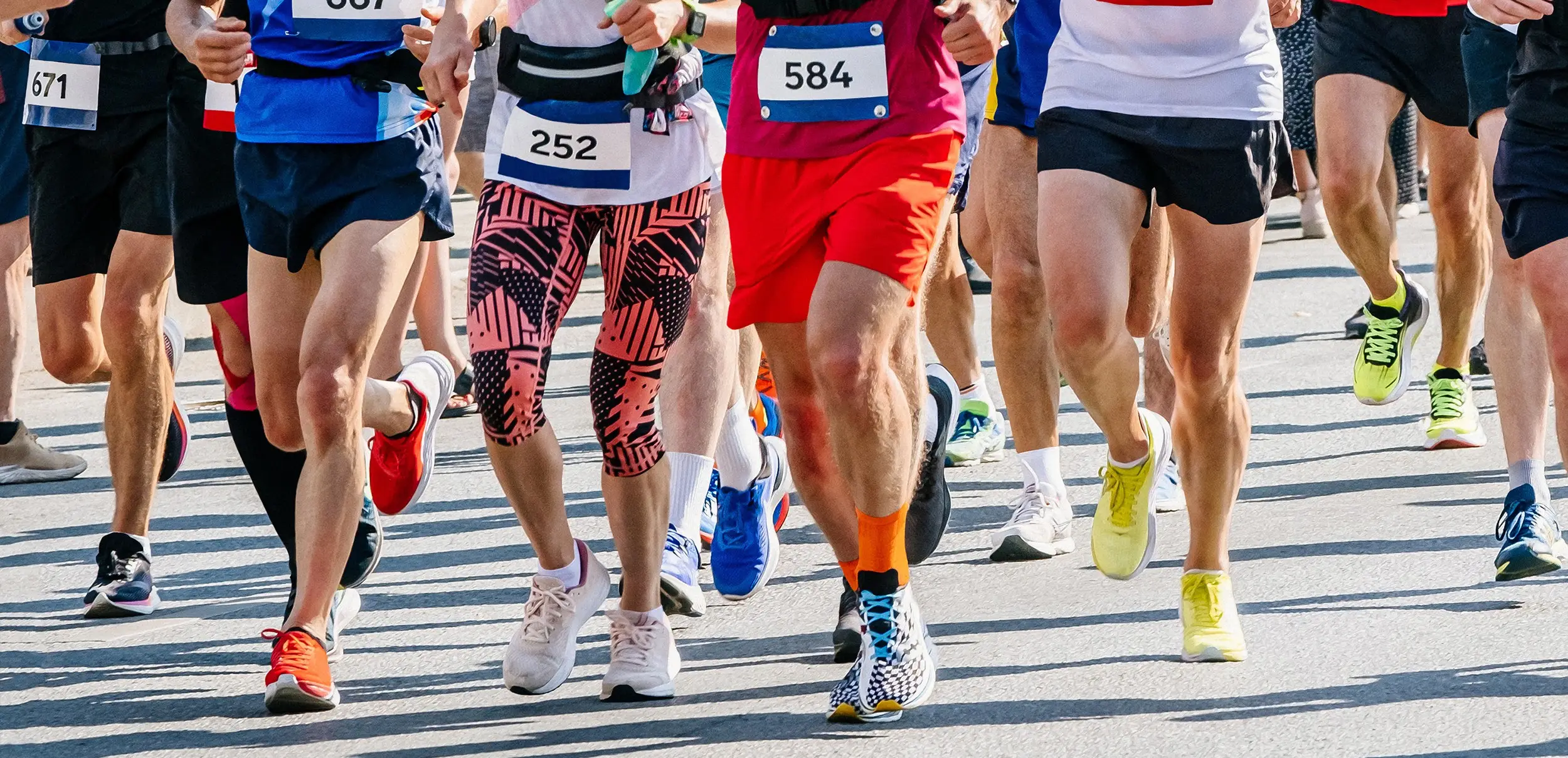 Group of runners during marathon representing active recovery for remote workers