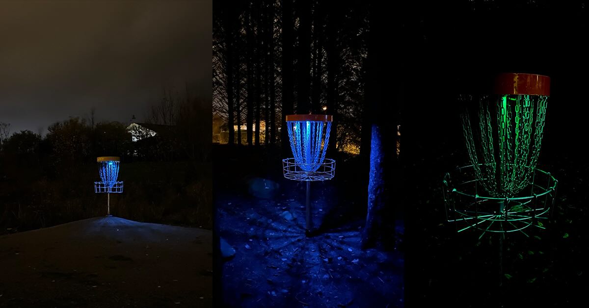 Disc golf baskets with with lights at night