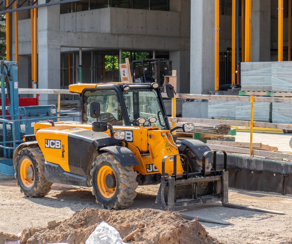 JCB Telehandler with forks on a construction site