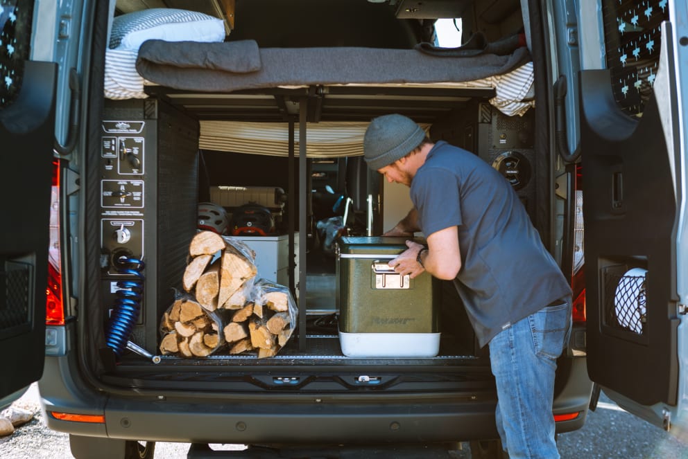 man unpacking storyteller overland