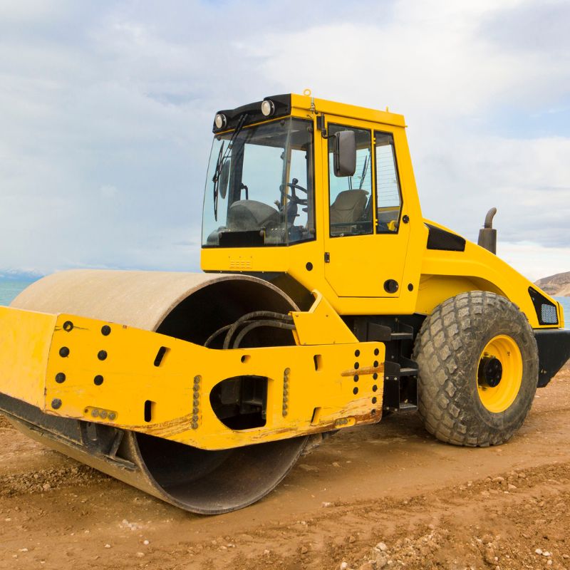 Smooth Roller Compacting Soil On A Job Site