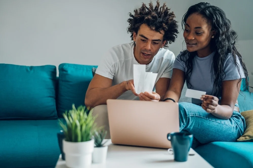 Young couple looking through accounts together