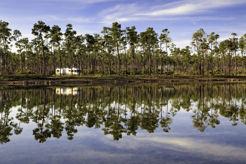 RV driving by lake in the Florida Everglades