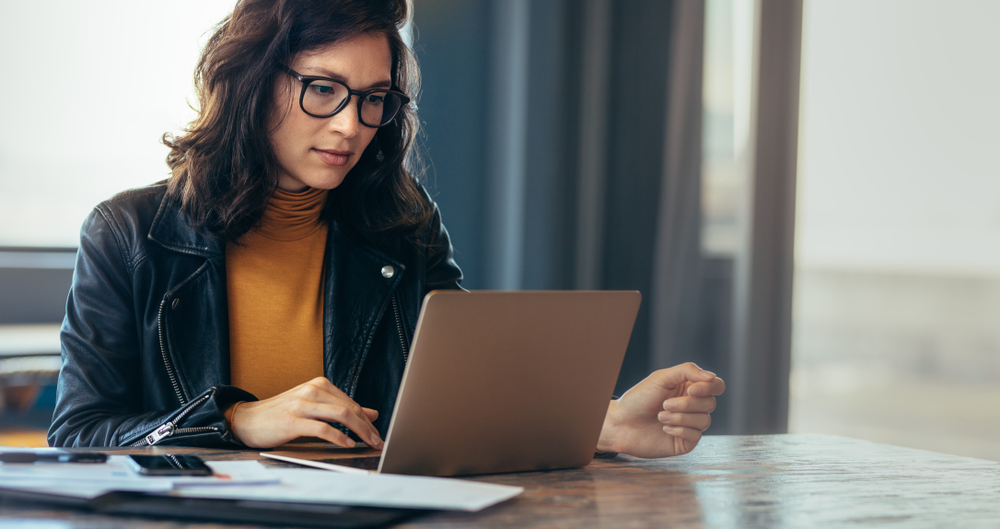 woman researching on laptop