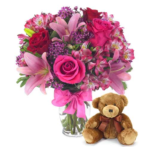 hot pink roses and pink alstroemeria flower bouquet with teddy bear