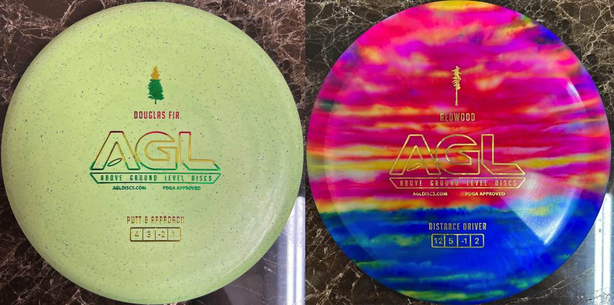Two disc golf discs side by side. One speckled pale green and another with multicolor dye reminiscent of sunset