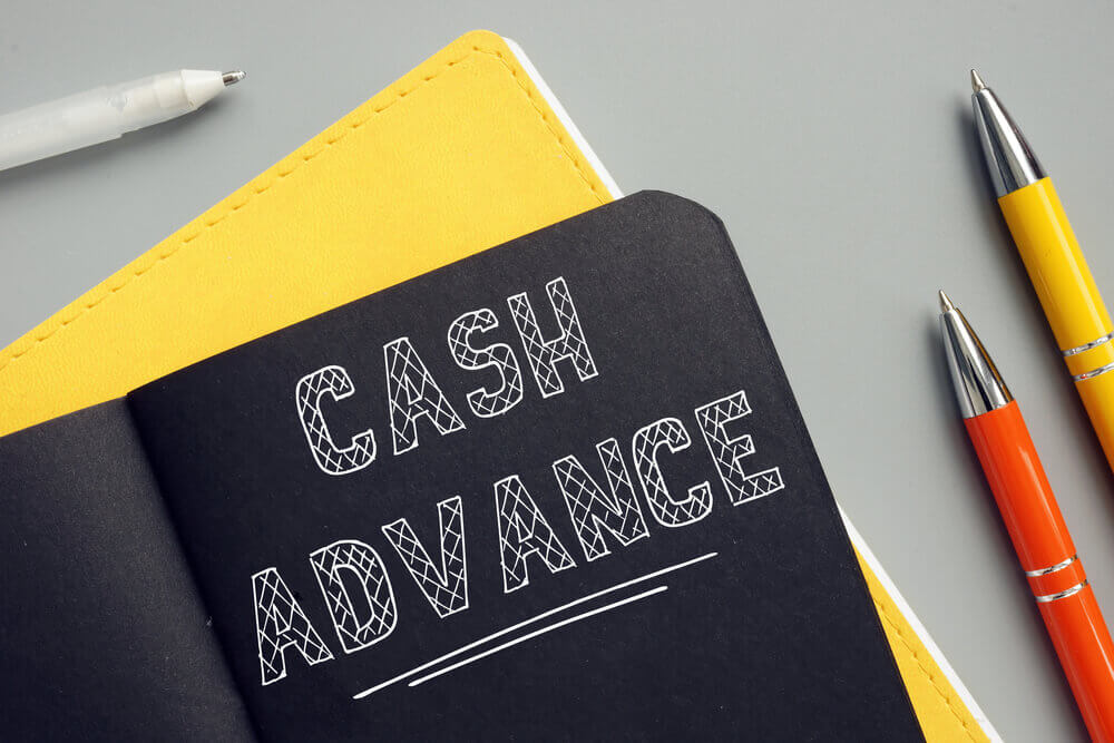 cash advance written on notepad