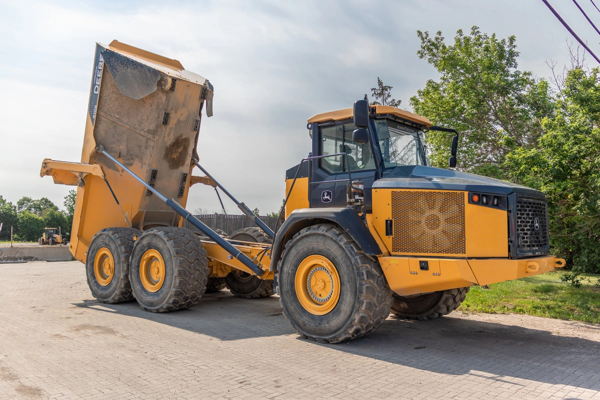 John Deere 410 dump truck with it's body in dumping position