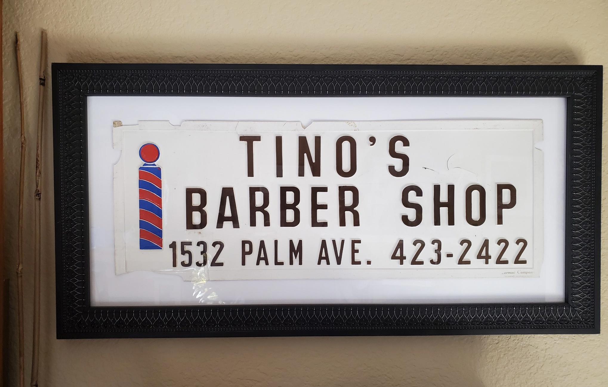 framed barber shop sign